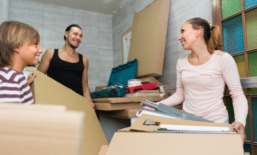 Professional removal services in Ilford with moving van and packed boxes