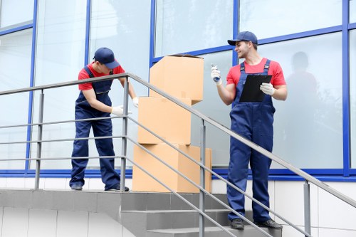 Removal team planning a move in Ilford residential street