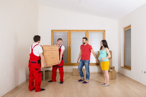 Packed business equipment ready for commercial moves in Ilford