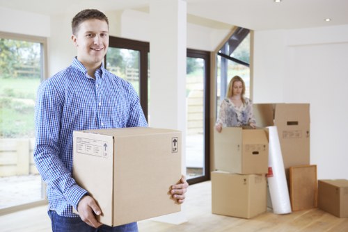 Boxes and furniture being loaded into a moving van