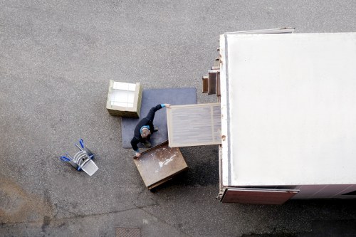 Professional movers handling items carefully during a safe Ilford van job
