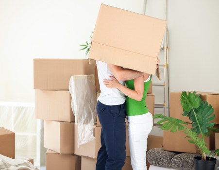 Boxes and furniture being loaded for flat removals