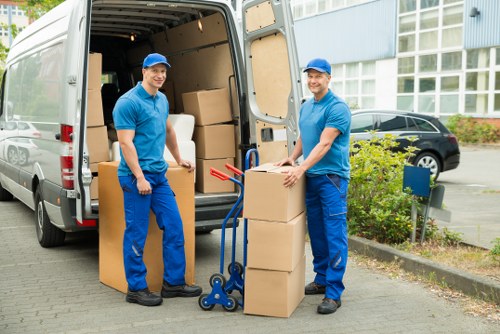 Removal team loading furniture for a home move in Ilford