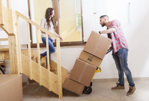 Office furniture removals in Ilford with desks and chairs prepared for transport