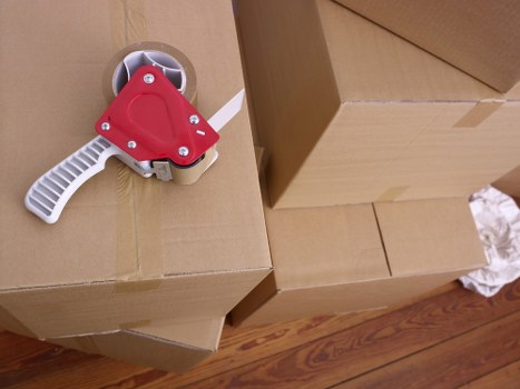 Loading furniture into a moving truck in Ilford