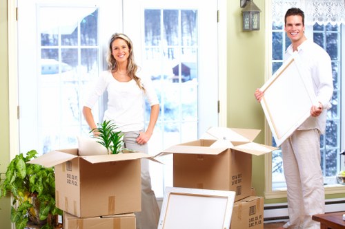 Packed moving boxes and furniture ready for transport in Ilford